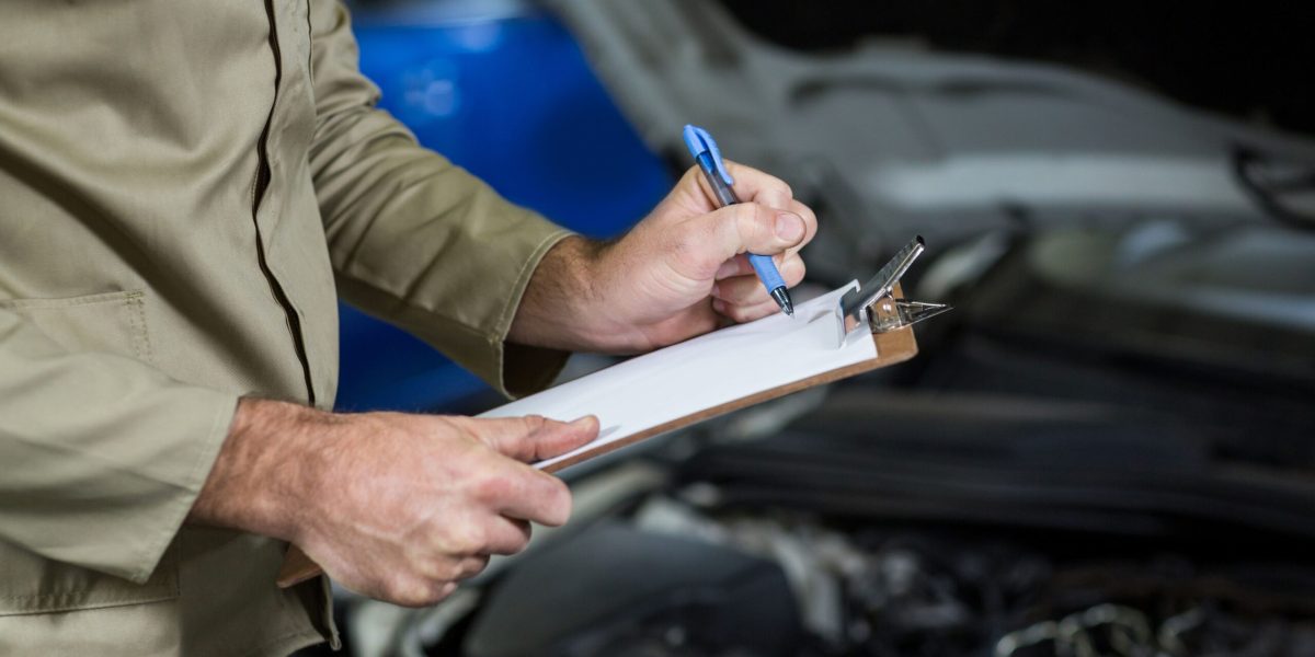 mid-section-mechanic-preparing-check-list (1)